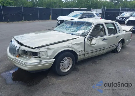 1997 Lincoln Town Car Signature из США, поврежденный, VIN 1LNLM82W3VY746254